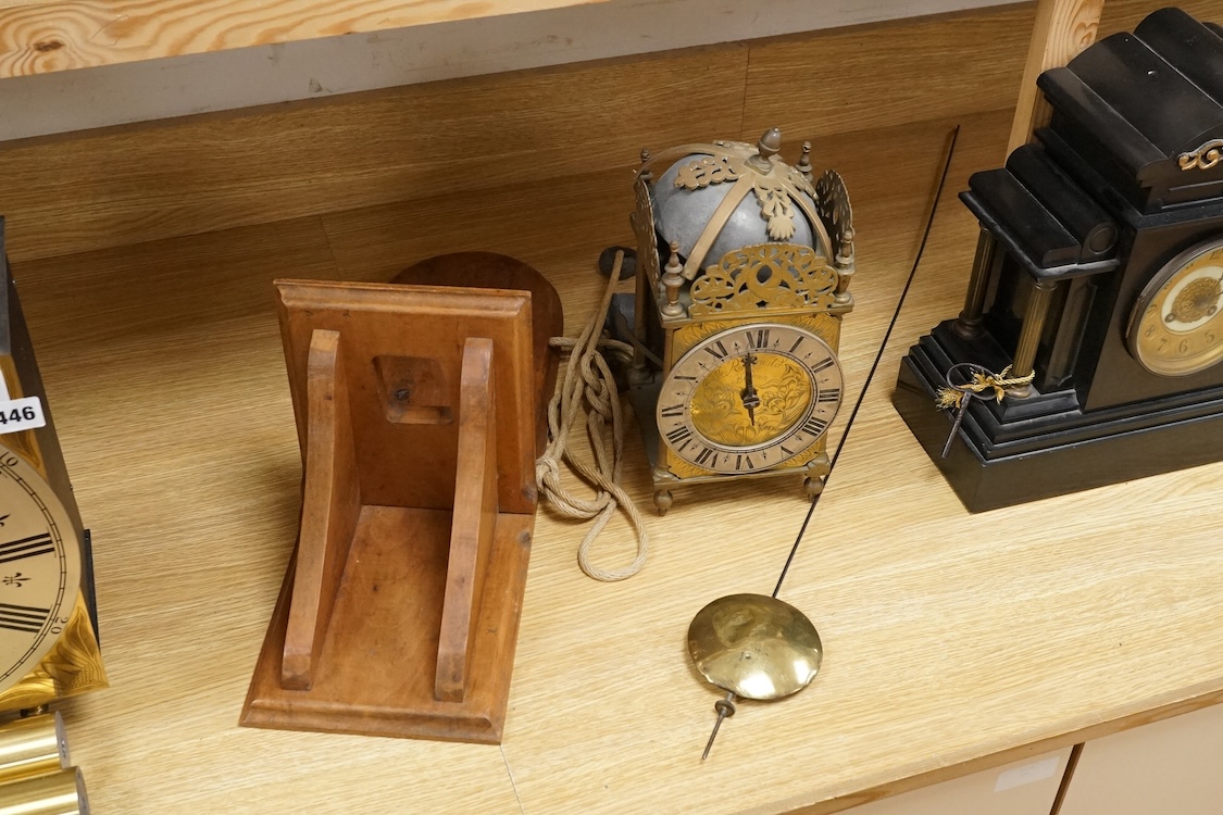R. Arnold, Bodmin, a lantern clock on wooden wall shelf, clock 32cm high